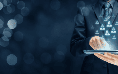 Un professionnel en costume interagit avec une tablette, sur laquelle s'affichent des icônes d'utilisateurs avec des cadenas, symbolisant la gestion et la protection des données personnelles par l'entreprise, conformément au RGPD.